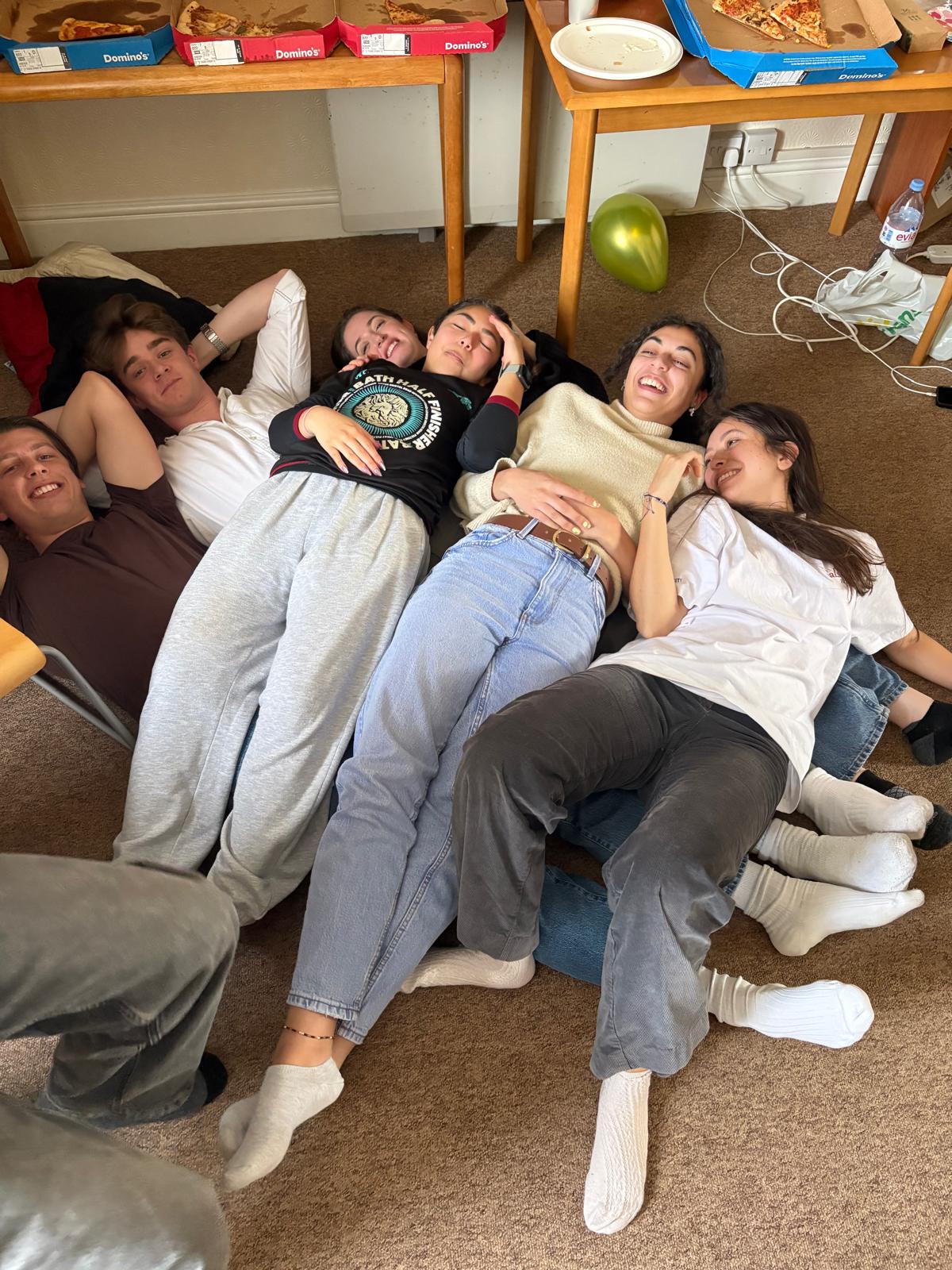 Gabriel and friends laughing on the floor